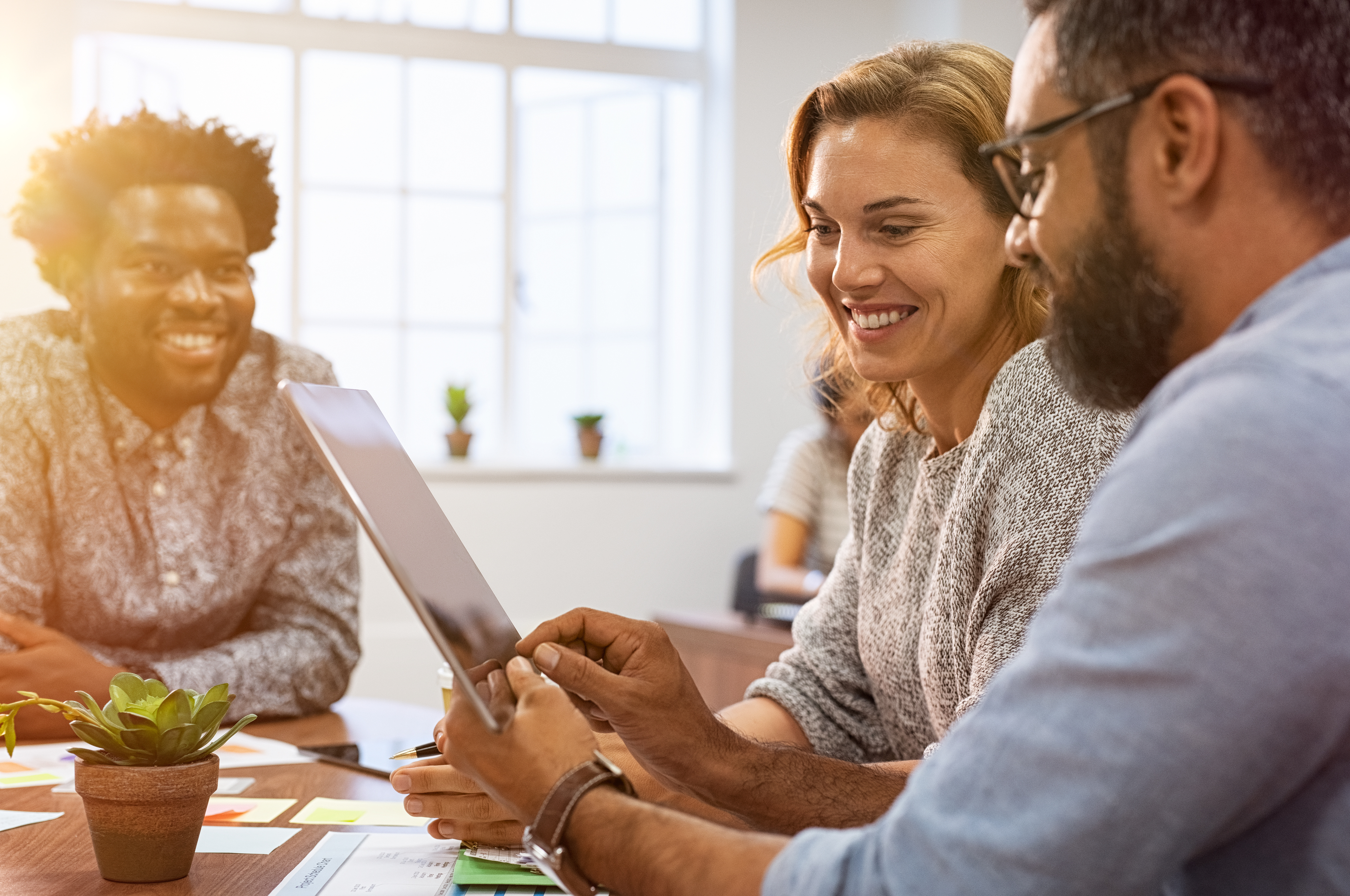 three people having a meeting